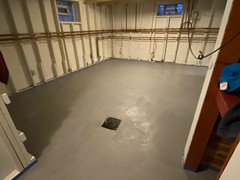 A resurface job we did in a basement. Filled in low spots and patched all repairs where needed using polymer cement. Finished with a polymer cement resurfacer that was tinted for a clean grey look.