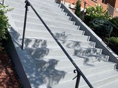 These steps required crack repair and a new finish. The finish is gray Saf-T-Deck elastomeric coating with non-skid surface.