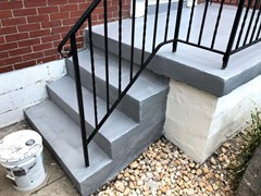 After pressure washing and repairing the side of these steps, a new finish coating drastically changed their look.