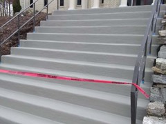 Before, during, and after photos of a set of stairs we repaired using polymer cement. Then resurfaced.  The finish for the stairs was our Grey colored Saf-T-Deck elastomeric sealant with anti-skid surface.