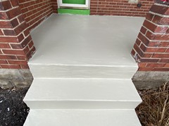 The porch had cracks and pieces missing from the steps. Our team repaired all cracks and rebuilt steps where needed using polymer cement. The finish look is a resurfacer on the entire porch and steps