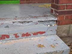 The porch had cracks and pieces missing from the steps. Our team repaired all cracks and rebuilt steps where needed using polymer cement. The finish look is a resurfacer on the entire porch and steps