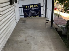 This porch needed power washing, crack repair, and rebuilt where some places crumbled